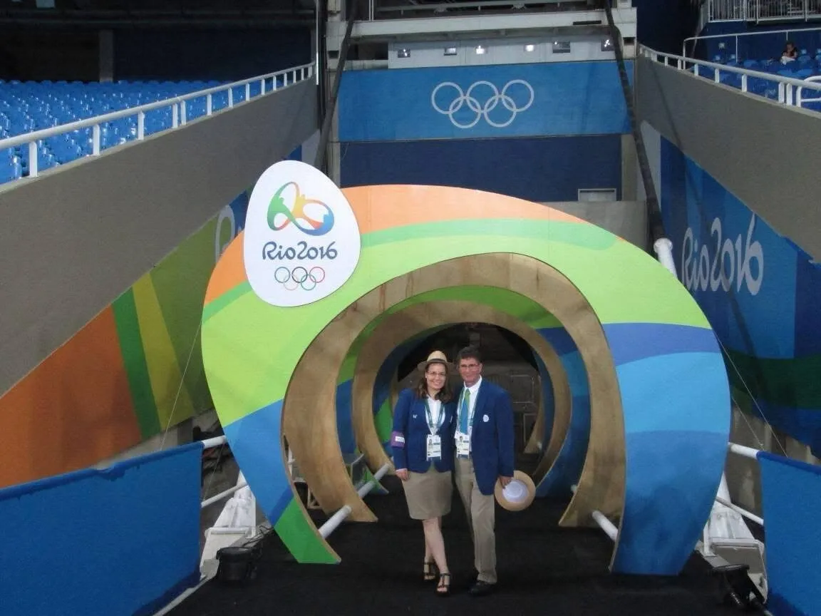Two people in the colorful Rio 2016 athlete tunnel.